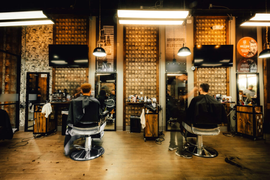 Barbershop interior with graffiti walls and barber tools on concrete counter