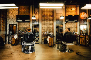Barbershop interior with graffiti walls and barber tools on concrete counter