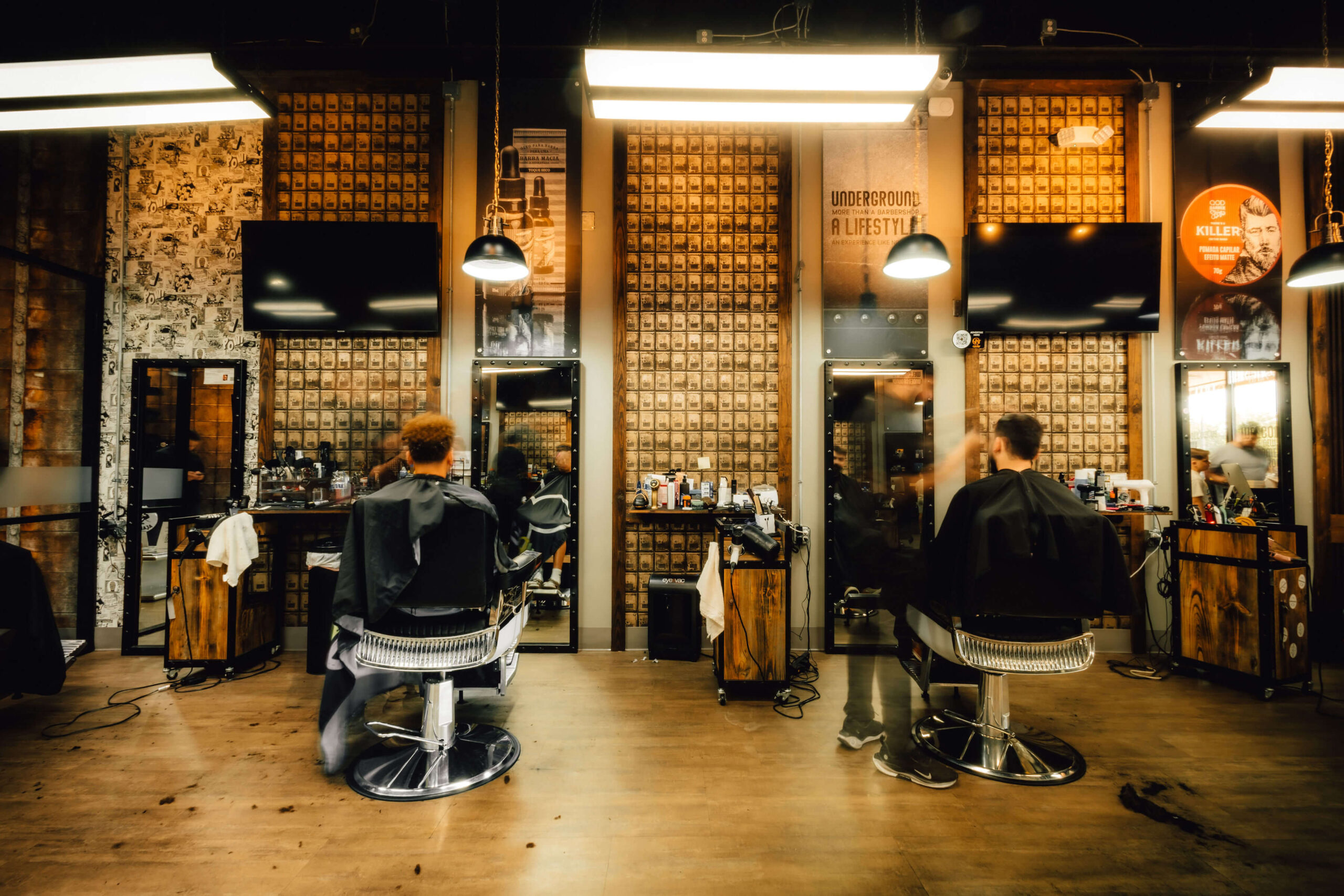 Barbershop interior with graffiti walls and barber tools on concrete counter